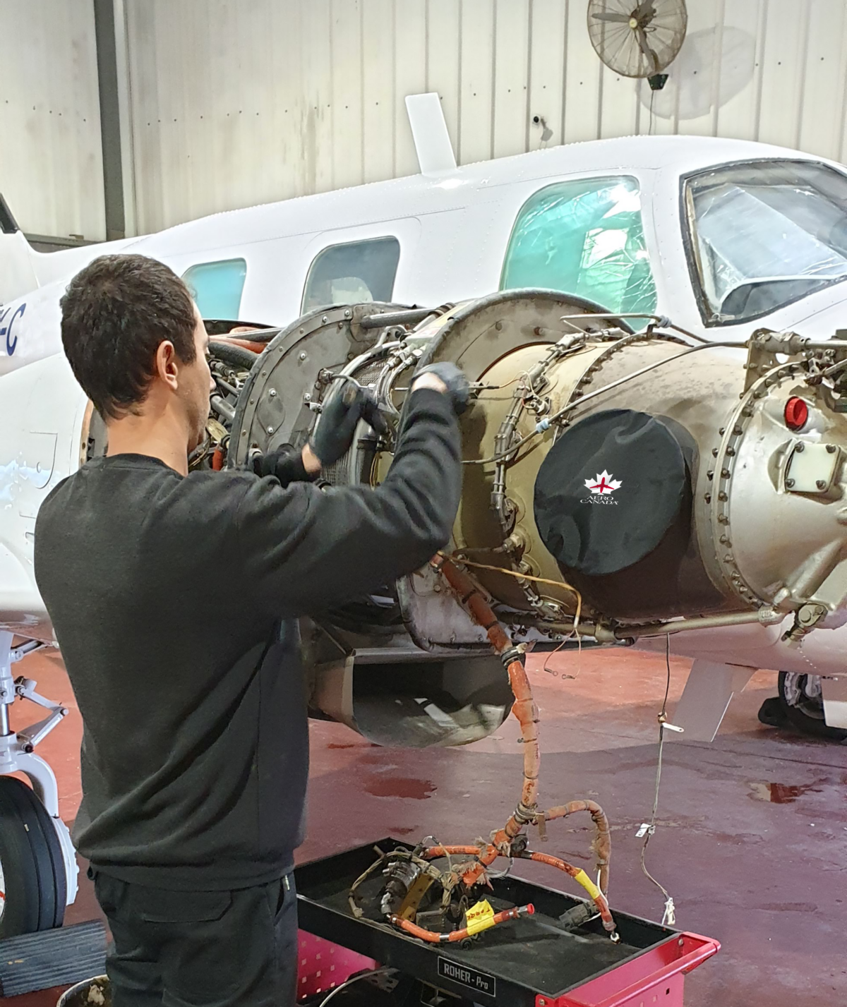 AeroCanada – MRO and Repair Services AeroCanada technician performing aircraft component repair in MRO workshop